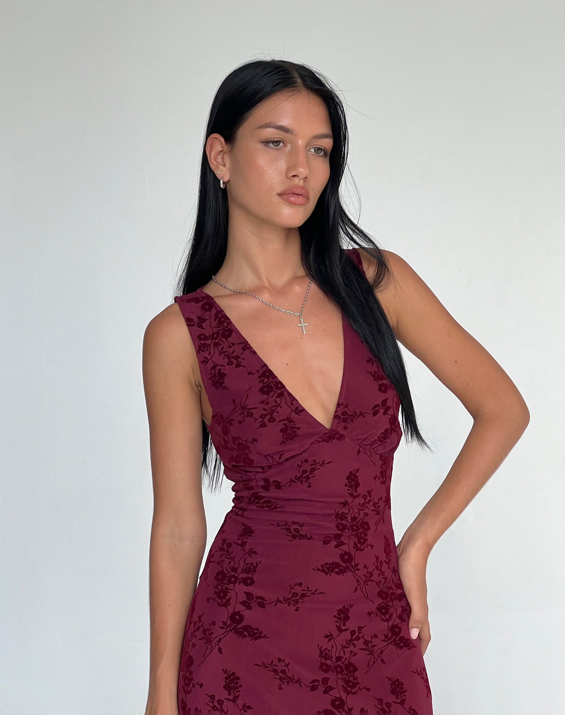 Maroon dress shop with flowers