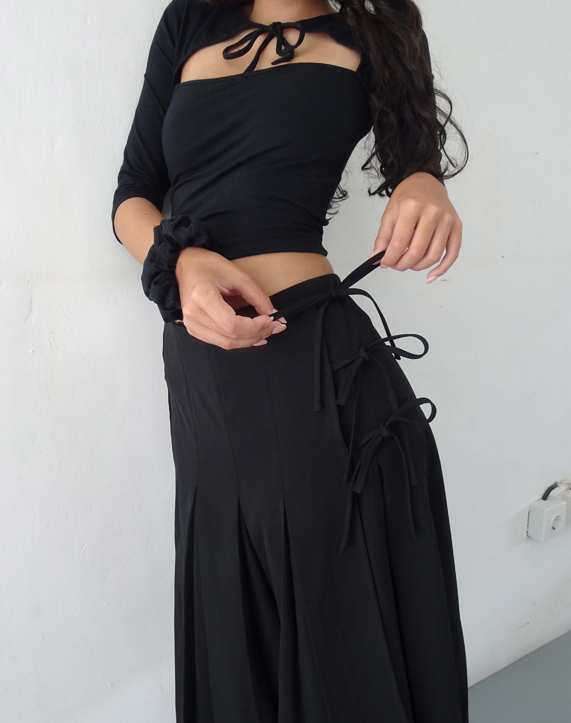Madelyn Pleated Midi Skirt in Black - Main Image