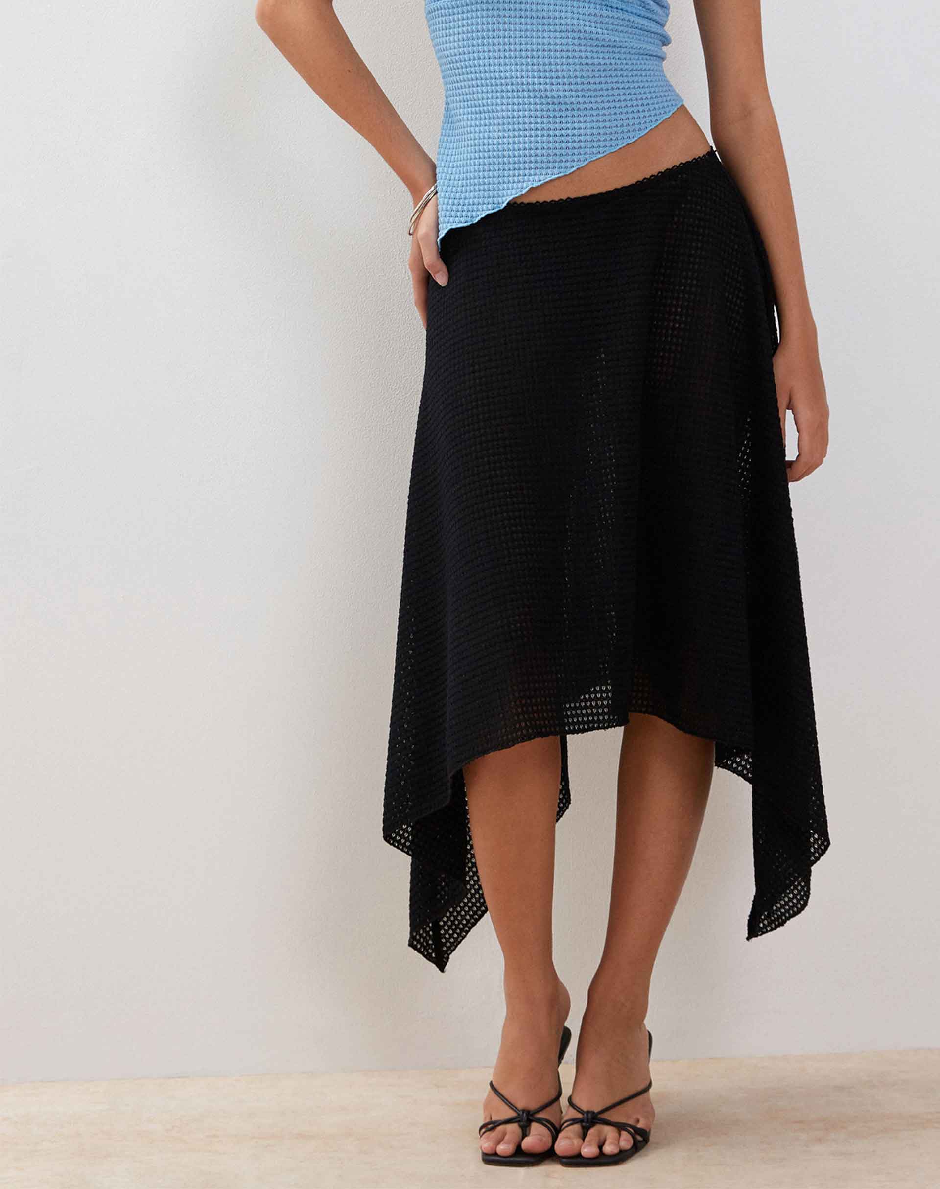 Image of Tullia Asymmetric Midi Skirt in Black Crochet