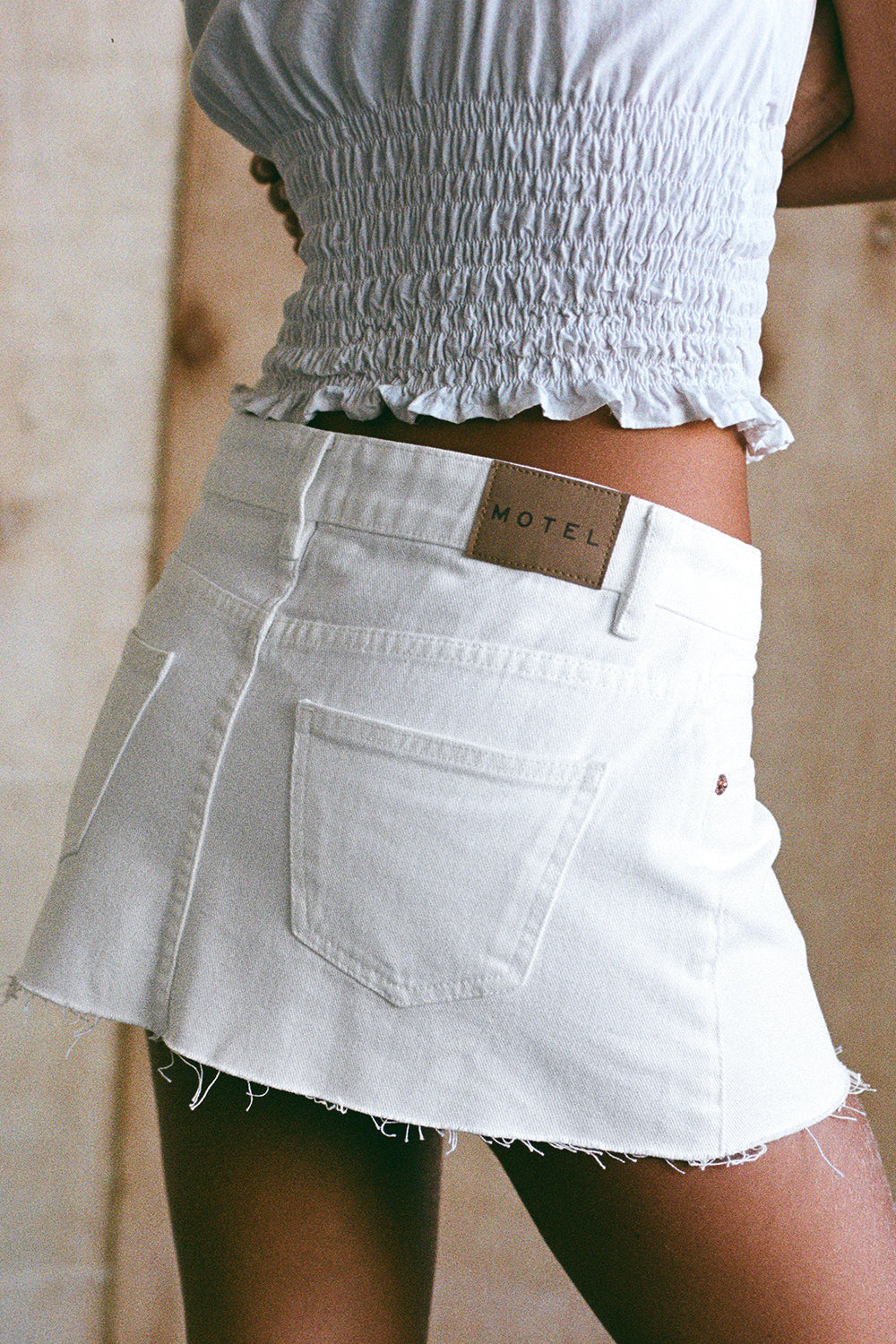 Image of Raw Hem Denim Mini Skirt in True White