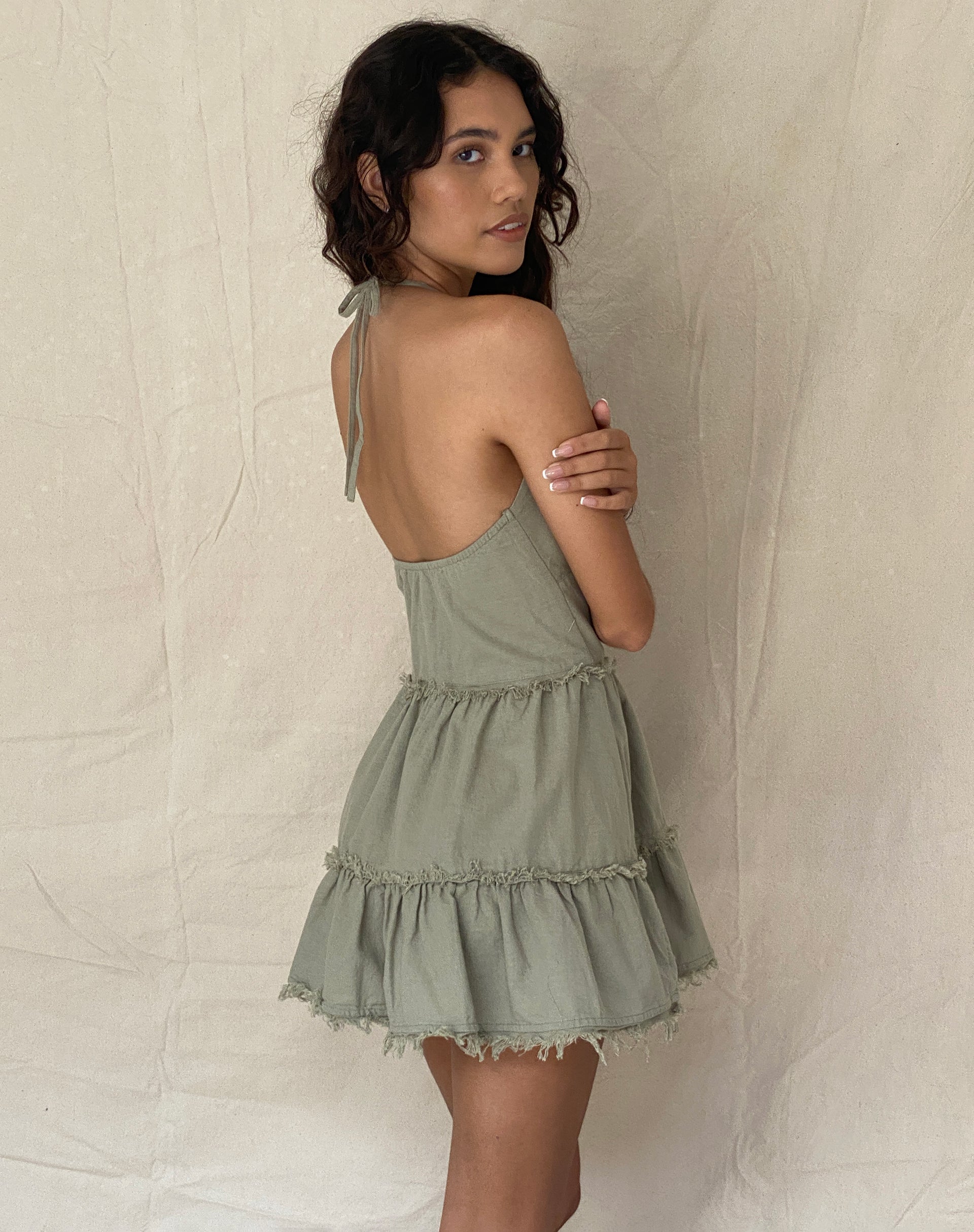 Image of Siskae Tiered Halter Mini Dress in Slate Green Linen