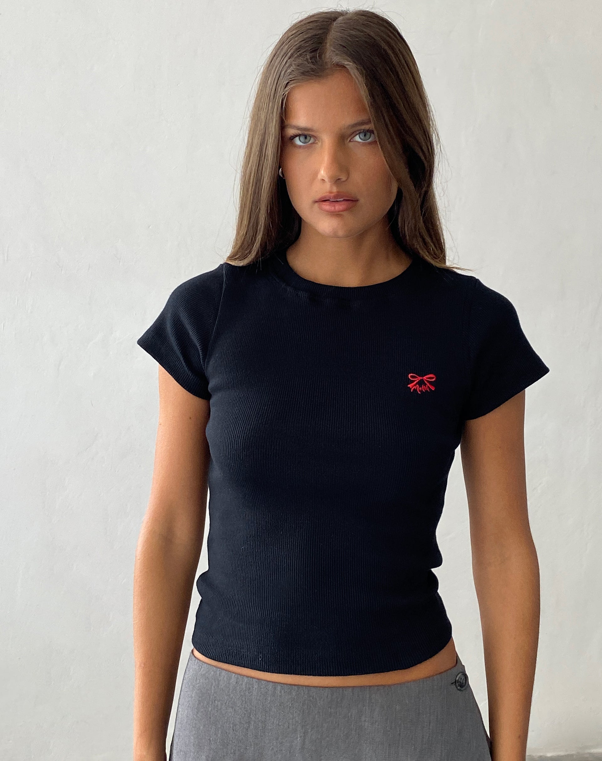 Image of Suti Ribbed Tee in Black with Red Bow M Embroidery