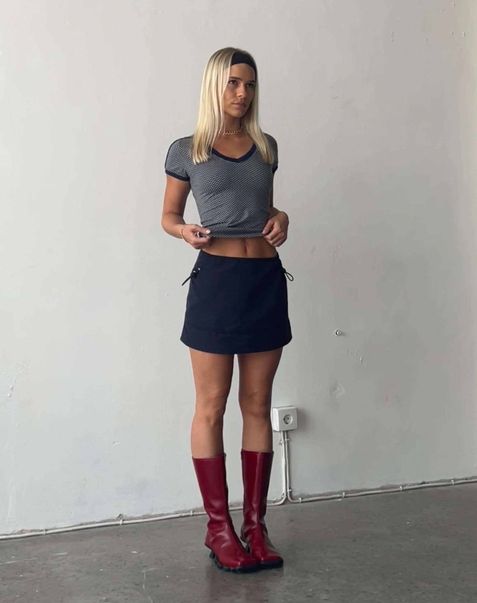 Image of Evy Cargo Mini Skirt in Navy with Black Piping